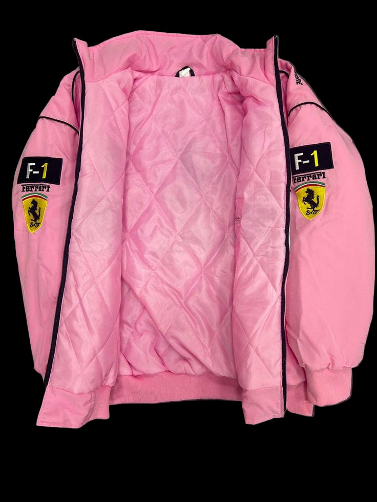 Pink quilted jacket with Ferrari logos on a dark textured surface